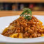 A well-composed and appetizing close-up of pasta with bolognese sauce, garnished with rosemary. The image is well-lit, sharp, and highly photo-realistic, showcasing the dish's texture and color accurately.