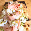 The image is sharp and features the key elements well in focus, particularly the mortadella, burrata, and pistachios. Colors appear accurate and the overall image is photo-realistic. The composition effectively frames the dish, making it the central subject. While generally well-lit, some areas, especially on the cheese, exhibit slightly harsh highlights, and the lighting could be more diffused to enhance texture and depth.